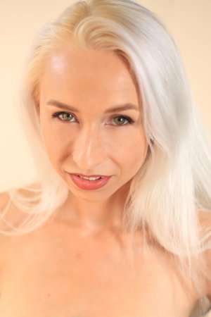 Merios bends to reveal her pussy beneath sheer lace photo 6