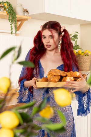 Cassie B in lingerie by kitchen wicker chair photo 2